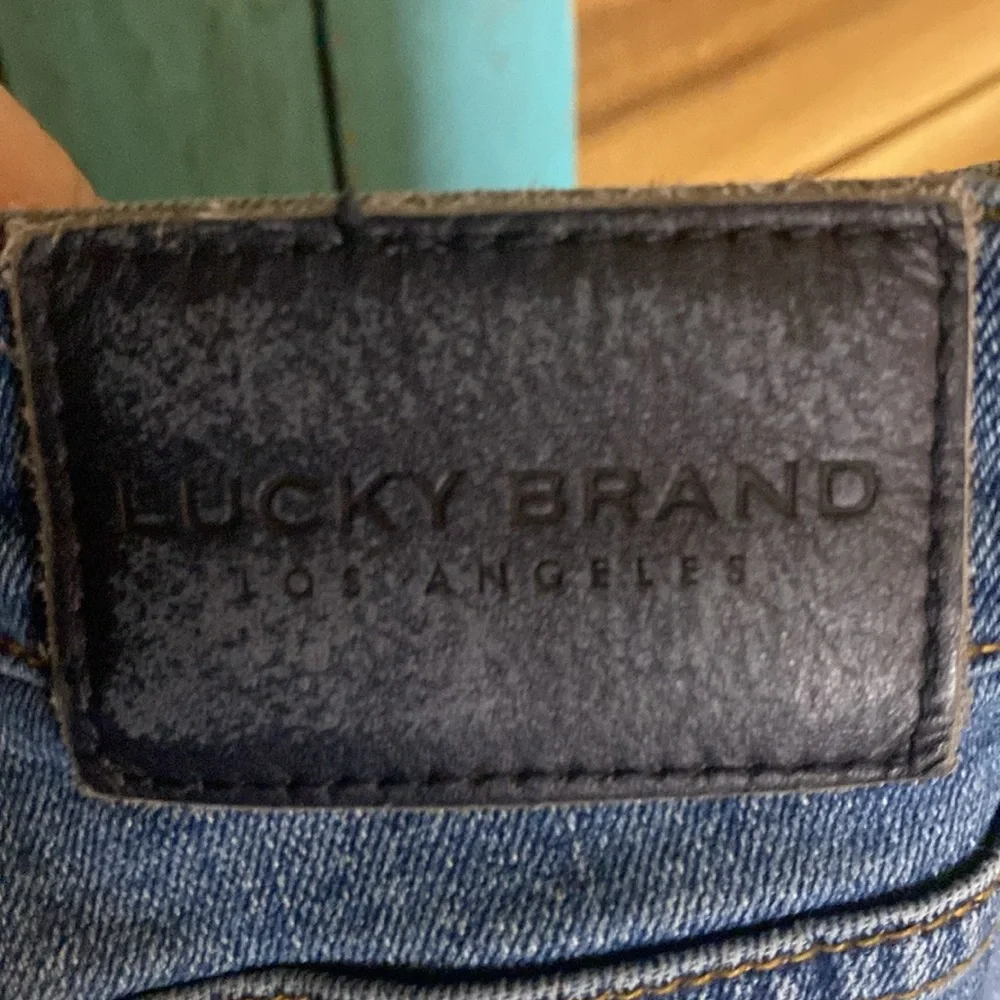 Lucky Brand 410 Athletic Slim jeans size 34x34 cuffs slit for boots